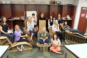 Students from the Interior Design Studio 1 course pose with the chairs they built using only cardboard and glue on Monday, October 14, 2013 in the Goebel Building.  Cardboard was scrounged from dumpsters to use as materials for the project.  Travis Taylor | Lariat Photo Editor
