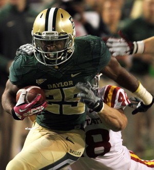 Junior running back Lache Seastrunk breaks a tackle during the second quarter of Baylor's win over Iowa State on Saturday, October 19, 2013 at Floyd Casey Stadium.  Seastrunk rushed for 112 yards and two scores.   Travis Taylor | Lariat Photo Editor