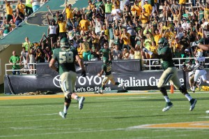 Junior running back Lache Seastrunk scores a touchdown and points to the sky in Baylor’s 70-7 win against ULM on Sept. 21 at Floyd Casey Stadium. Seastrunk has made an impact for Baylor after transferring from Oregon.  Robby Hirst | Lariat  Photographer