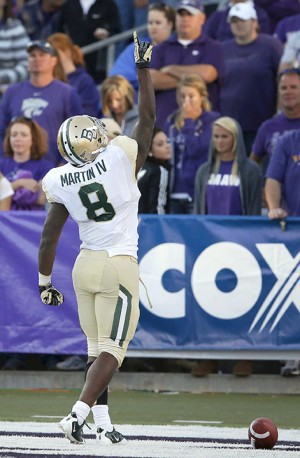 Baylor running back Glasco Martin (8) celebrates his touchdown during the second half of an NCAA college football game against Kansas State in Manhattan, Kan., Saturday, Oct. 12, 2013. Baylor defeated Kansas State 35-25. (AP Photo/Orlin Wagner)