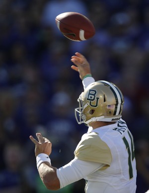 Junior quarterback Bryce Petty throws a pass on against Kansas State on Saturday in Manhattan, Kan. The Bears won 35-25. (Orlin Wagner | Associated Press)