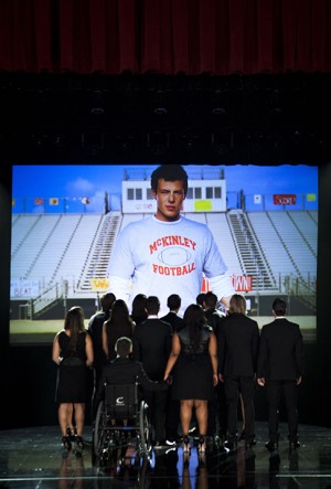This photo released by Fox shows the McKinley family of the past and present joining together to remember and celebrate the life of Finn Hudson in "The Quarterback" episode of "Glee." The high school musical drama said goodbye to Finn, its beloved singer-quarterback, while paying tribute to Cory Monteith, the late actor who had portrayed him, in a much-anticipated episode that aired Thursday, Oct. 10, 2013. (AP Photo/Copyright Fox, Adam Rose)