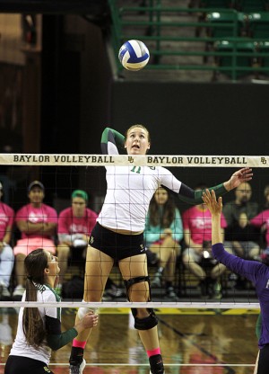 Redshirt freshman middle hitter Sam Hill goes up for a spike during Baylor's game against Kansas State Wednesday at the Ferrell Center.  Hill finished the game with eight kills and a .333 hitting percentage.   Travis Taylor | Lariat Photo Editor