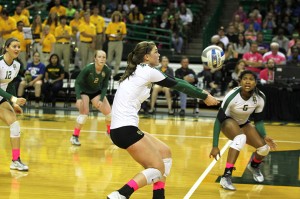 Sophomore outside hitter Laura Jones prepares to pass as junior middle hitter Nicole Bardaji looks on in a match against Kansas State on Oct. 23 at the Ferrell Center. The Bears begin the second half of Big 12 play at Kansas. Travis Taylor | Lariat Photo Editor