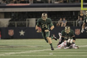 Junior quarterback Bryce Petty rushes the ball in Baylor’s 63-34 win over Texas Tech on Saturday at AT&T           Stadium in Arlington. The Bears take on No. 10 Oklahoma State in Stillwater, Okla., on Saturday.  Travis Taylor | Lariat Photo Editor