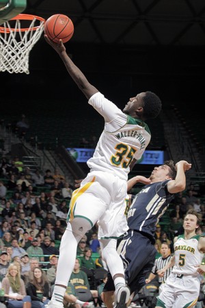 Sophomore forward Taurean Prince puts in a layup after a fast break during Baylor's game against Charleston Southern University.  Baylor leads 32-28 at halftime.  Travis Taylor | Lariat Photo Editor