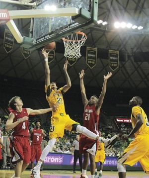 Sophomore center Isaiah Austin puts in a layup during the second half of Baylor's victory over the University of Louisiana-Lafayette.  Austin had eight points and eight blocks during the game.   Travis Taylor | Lariat Photo Editor
