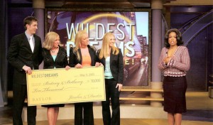 Oprah Winfrey presents sisters Britney and Bethany Wekesser with a $300,000 check for college. (Courtesy Photo)