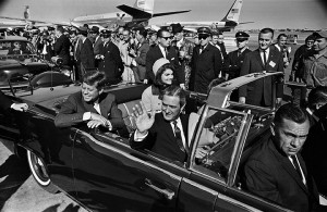 Texas Gov. John Connally waves as the Connallys and Kennedys set off on what would be the presidentÕs final ride on Nov. 22, 1963. One of the modifications to the stock 1961 Lincoln Continental convertible was the addition of a middle row of jump seats. (Tom Dillard/Dallas Morning News/MCT)