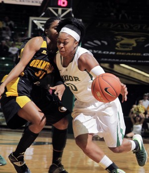 Senior guard Odyssey Sims drives against Grambling State's defense during the first half at the Ferrell Center.  Travis Taylor | Lariat Photo Editor