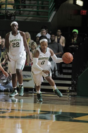 Senior point guard Odyssey Sims dribbles up the court as junior post Sune Agbuke looks on in Baylor’s 111-58 win over Nicholls State on Thursday.  Travis Taylor | Lariat Photo Editor