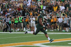 Senior defensive end Chris McAllister returns an interception for a touchdown against Wofford on Aug. 31. Baylor defeated Wofford 69-3. Baylor’s defense was the No. 19 scoring defense in the FBS, allowing 21.2 points per game.  Travis Taylor | Lariat Photo Editor