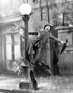 FILE - In this undated file photo, Gene Kelly performs in the 1952 film "Singin' in the Rain." The grey wool suit Kelly wore in the movie is going up for auction after being kept in a closet by a memorabilia collector for more than four decades. (AP Photo/File)