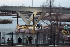 Two workers fell into the Brazos River while working on the pedestrian bridge that crosses to Baylor Stadium on Tuesday, January 28, 2014.  One of the workers is still missing, while the second worker is being treated for hypothermia.   Travis Taylor | Lariat Photo Editor