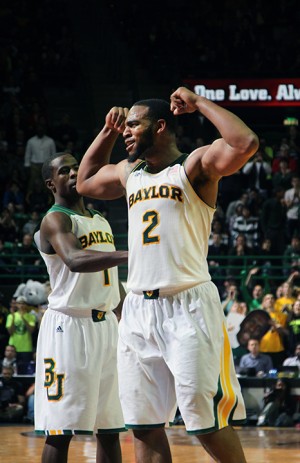 Sophomore forward Rico Gathers celebrates with his fellow Baylor bears during the game against Kansas on Tuesday at the Ferrell Center.