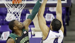 Baylor forward Cory Jefferson (34) defends the basket against TCU forward Amric Fields (4) during the first half of an NCAA college basketball game Wednesday, Feb. 12, 2014, in Fort Worth, Texas. (AP Photo/LM Otero)