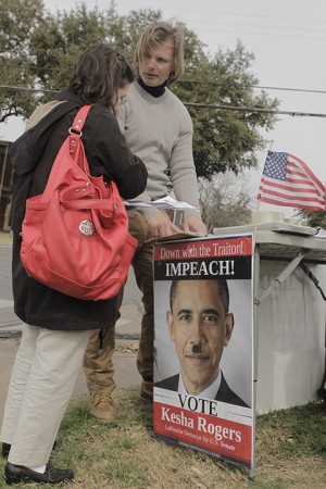 Ben Tatro, 32, speaks with Harlingen senior Jacqueline Lopez on the platform of Kesha Rogers, who is running for the United States Senate, on Wednesday, February 26, 2014 on South 5th Street and Bagby Avenue.  Rogers, a LaRouche Democrat, is running on a platform for the impeachment of President Barack Obama.   Travis Taylor | Lariat Photo Editor