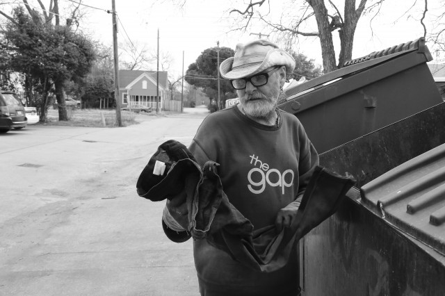 Chuck Rose, a Waco homeless man, goes through a dumpster on February 1, 2014, looking for cans for money to life on. He found a pair of jeans with the tags still on them. "Instead of donating them, they throw them in the trash. Come on, give me a break. Everything I'm wearing came from a dumpster." 