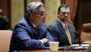 University of Texas System Chancellor Francisco Cigarroa, left, listens to a question as Board of Regents Chairman Paul Foster, sits near during a news conference where he announced his resignation Monday, Feb. 10, 2014, in Austin, Texas. Cigarroa, who has held the position for five years, will continue to serve as chancellor until his successor is named. (AP Photo/Eric Gay)