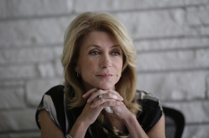 Democratic candidate for Texas governor Wendy Davis takes part in a interview, Tuesday,  Jan. 21, 2014, in Austin, Texas. Davis promised to veto a state income tax to pay for public schools and to expand where people may carry their handguns in the interview. (AP Photo/Eric Gay)