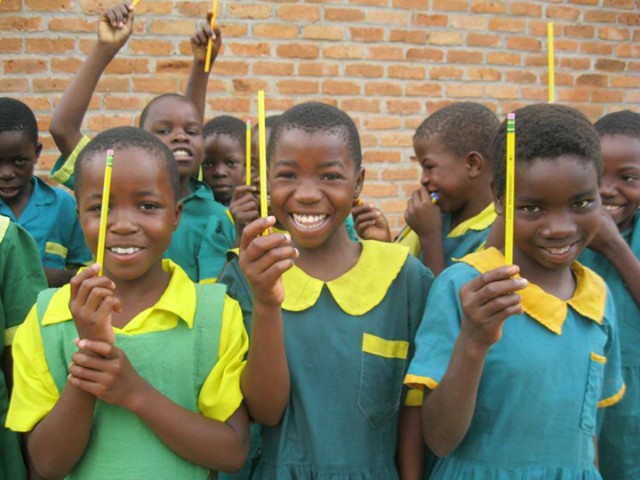 Children in Malawi, Africa, receive their pencils during school one day. Upward Bound is collecting pencils to send to a school in Swaziland, Africa, and an elementary school in Alabama. Courtesy Photo