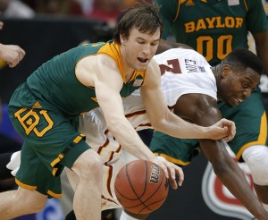 Baylor guard Brady Heslip, left, and Iowa State forward Melvin Ejim (3) chase a loose ball during the first half of an NCAA college basketball game in the final of the Big 12 Conference men's tournament in Kansas City, Mo., Saturday, March 15, 2014. (AP Photo/Orlin Wagner)