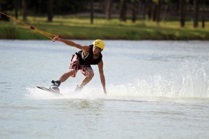 Wake boarders ride on the lake at the BSR Cable Park on Wednesday, September 18, 2013.  Travis Taylor | Lariat Photo Editor