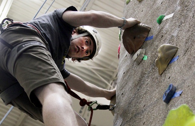 Freshman Brian Hafferkamp focuses as he climbs the rock wall in the Student Life Center. Hafferkamp, along with five other Baylor students, participated in Outdoor Adventure's Intro to Sports Climbing course. The participants learned how to safely climb in an outdoor environment and help other climbers. Carlye Thornton | Lariat Photographer