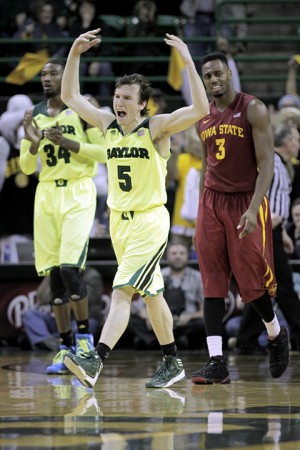 Senior guard Brady Heslip tries to pump up the crowd during the second half of Baylor's 74-61 win over Iowa State on Tuesday at the Ferrell Center. Heslip scored 15 points in the second half for the Bears.  Travis Taylor | Lariat Photo Editor