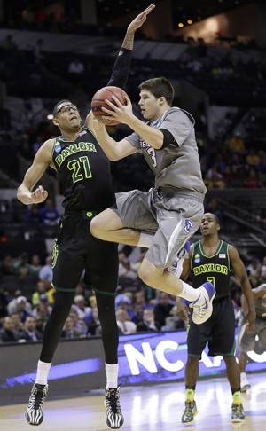 Creighton's Doug McDermott (3) is defended by Baylor's Isaiah Austin (21) as he drives to the basket during the second half of a third-round game in the NCAA college basketball tournament Sunday, March 23, 2014, in San Antonio. Baylor won 85-55. (AP Photo/Eric Gay)