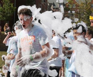 Forrest Sanderson, a Baylor University freshman from Denver, Colo., gets pelted with suds during the form run, a 4.1-kilometer race through campus at the annual Diadeloso “Day of the Bear.”