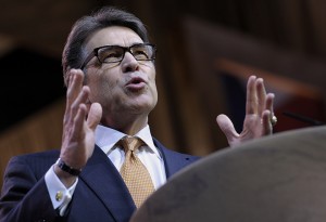In this March 7, 2014 file photo, Texas Gov. Rick Perry speaks at the Conservative Political Action Committee annual conference in National Harbor, Md. Special State District Judge Bert Richardson is expected to seat a grand jury Monday, April 14, 2014, in Austin, Texas, in an investigation into whether Republican Gov. Rick Perry abused his power by vetoing funding for public corruption prosecutors. The investigation began after Perry vetoed $7.5 million in funding last summer for a public integrity unit under Travis County District Attorney Rosemary Lehmberg. (AP Photo/Susan Walsh)