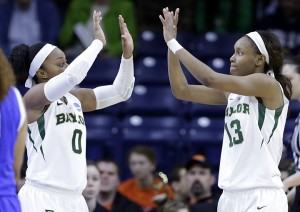 Baylor forward Nina Davis (13) celebrates with guard Odyssey Sims (0) after scoring a basket during the second half of a regional semifinal in the NCAA college basketball tournament against Kentucky at the Purcell Pavilion in South Bend, Ind., Saturday, March 29, 2014.  . Baylor won 90-72. (AP Photo/Nam Y. Huh)