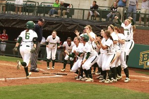 Senior first baseman Holly Holl runs to home plate to celebrate with teammates after hitting a home run in Friday’s  3-2 loss to Oklahoma at Getterman Stadium. Baylor is 30-9 overall and 4-3 in the Big 12 Conference. 