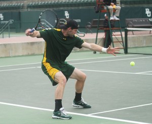 Junior Mate Zsiga aims to return a shot in Baylor’s 7-0 victory against Texas Tech on April 5 at the Hurd Tennis Center. The men’s tennis team is ranked No. 6 and is 21-5 overall and 4-1 in the Big 12 Conference. 