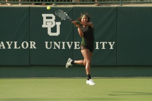 Sophomore Kiah Generette follows through on a return shot in Baylor’s 5-2 win over No. 23 Oklahoma State at the Hurd Tennis Center on April 11. 