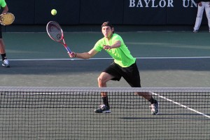 Sophomore Julian Lenz returns a shot in No. 6 Baylor’s 5-2 victory over No. 7 Texas on Wednesday at the Hurd Tennis Center. Baylor men’s tennis is 21-5 on the season. The Bears won the Big 12 Championship by winning the match. The Bears were perfect at home this season with a 15-0 record. 