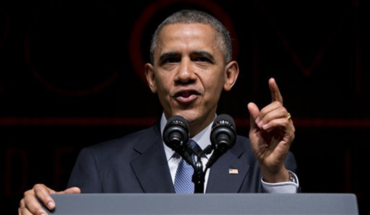President Barack Obama speaks in 2014 at the LBJ Presidential Library, in Austin during the Civil Rights Summit to commemorate the 50th anniversary of the signing of the Civil Rights Act. Thursday, Obama said he want to expand the private sector's use of cybersharing.  Associated Press
