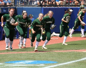 The Baylor softball team takes the field during the first game of the Women's College World Series in Oklahoma City.