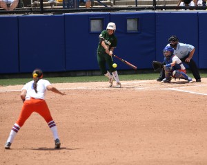 Center fielder Lindsey Cargill gets a hit in the first game against Florida in the softball Women's College World Series in Oklahoma City.