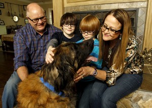 The Harris family, from left, Jamie, Cole, Case, Marian pose with their Leonberger Sid. Marian Harris said the clinic told her the dog needed to be euthanized, but she was later called by a former employee who said the animal was kept alive for six months to obtain plasma.