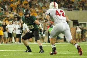 No. 38 senior nickelback Collin Brence faces off against an SMU player on August 31, 2014 at McLane Stadium. The Bears defeated the Mustangs 45-0.Kevin Freeman | Lariat Photographer