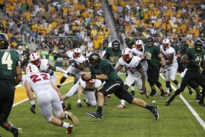 Senior quarterback Bryce Petty rushes for a touchdown at the first half of Baylor's game against SMU. At the half, Baylor leads 31-0.Lariat File Photo