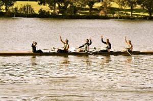 Members of the Baylor Crew team do a Sic ‘Em while rowing on the Brazos.Courtesy Photo