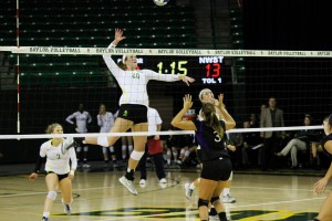 Junior middle hitter Adrien Richburg goes up for a spike against Northwestern State on Sept. 16 at the Ferrell Center. Baylor volleyball vanquished the Demons 3-1 for its fifth straight win of the season.  Skye Duncan | Lariat Photographer