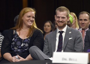 Ebola survivor Dr. Kent Brantly, second from right, former Medical Director of Samaritan's Purse Ebola Care Center in Monrovia, Liberia,  smiles as he and his wife Amber, left, are recognized at the Senate Appropriations Subcommittee on Labor, Health and Human Services, and Education joint hearing on, "Ebola in West Africa: A Global Challenge and Public Health Threat," on Capitol Hill in Washington, Tuesday, Sept. 16, 2014.Susan Walsh | Associated Press