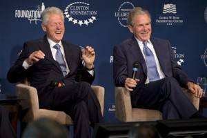 Former Presidents Bill Clinton, left, and George W. Bush, laugh while participating in the Presidential Leadership Scholars Program Launch, Monday, Sept. 8, 2014, at The Newseum in Washington. The two are launching a new scholars program at four presidential libraries, aiming to help academics and business leaders learn more about presidential leadership.Jacquelyn Martin | Associated Press