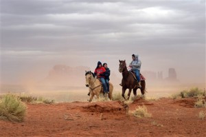 In this Jan. 30, 2014, file photo, Jaydon Yazzie, VanteJren Atene, and McKalette Clark ride home from Monument Valley High School in Monument Valley, Utah. The school must prepare its 216 students, who grow up amid the Navajo Nation’s iconic red mesas, for success in the wider world.Associated Press