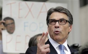 On Aug. 19, Gov. Rick Perry talks to the media and supporters after he was booked at the Blackwell Thurman Criminal Justice Center in Austin.Associated Press
