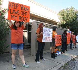 People protest in front of the Whole Women’s Health clinic Saturday, Oct. 4 in McAllen, Texas. Abortion-rights lawyers are predicting “a showdown” at the U.S. Supreme Court after federal appellate judges allowed full implementation of a law that has closed more than 80 percent of Texas’ abortion clinics.Associated Press